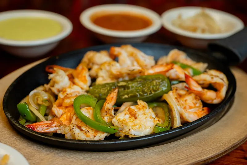 Sizzling shrimp skillet with peppers and onions at Lupita's