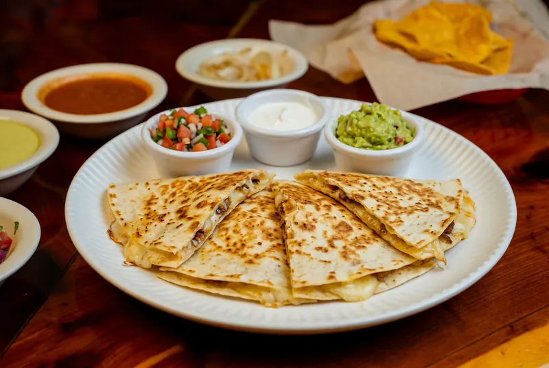 Quesadilla with salsa and side dishes