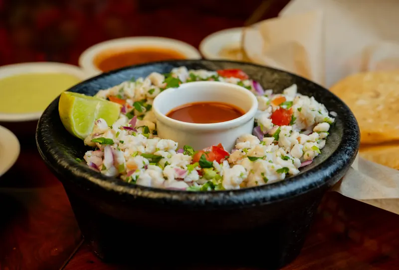 Fresh ceviche with lime, cilantro, and salsa at Lupita's